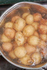New potatoes boil in their skins in a saucepan