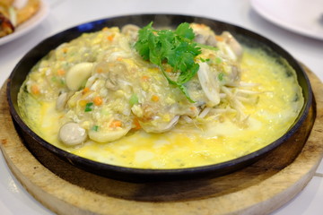Close up Oyster Omelette in Hot Pan.