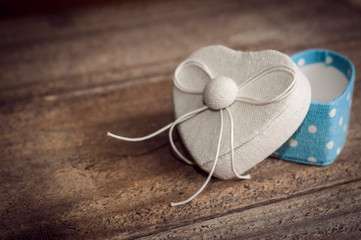 Heart shaped box for a newborn boy on wooden table