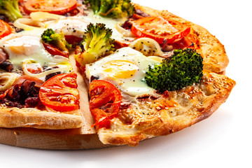 Vegetarian pizza with eggs, broccoli and onion