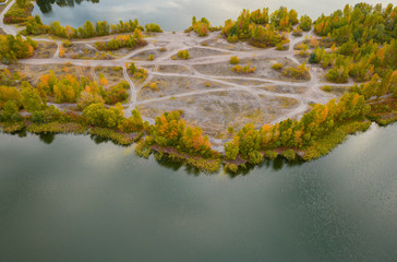 Сolorful autumn landscape with river and beautiful fall trees aerial view drone shot