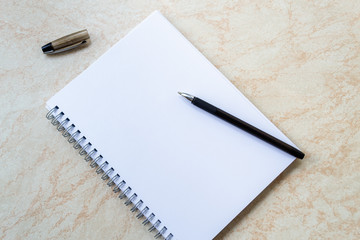 Empty white notepad with black pen. with space for your text.