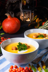 Delicious pumpkin soup with croutons and coconut milk