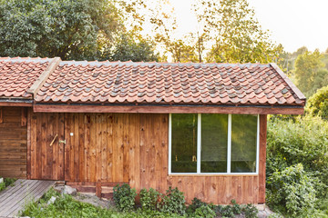 wooden extension in the bathhouse. Tiled Roof Wooden House