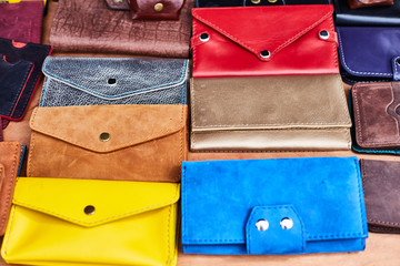 Handmade multi-colored leather wallets on the market.