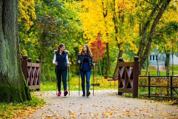 Nordic walking - active people working out in park