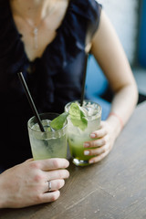 guy and girl holding glasses with lemonade
