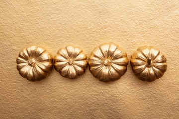 Golden thanksgiving pumpkin overhead flay lay composition
