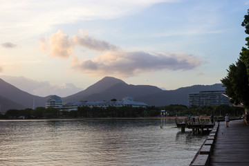 Early morning walkers on Cairns Esplanade boardwalk, Cairns in Tropical North Queensland, Australia