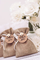 Rustic wedding favors and roses