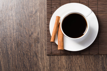 Cup of black coffee on wooden table