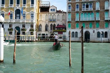 Venice / Italy - September 29th 2019: Gondolier rowing a gondola in Grand Canal © Roberto Vivancos