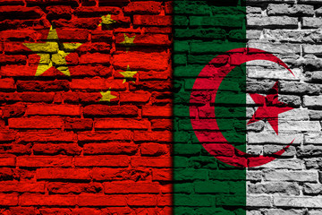 Flag of Algeria and China on brick wall