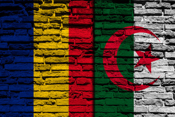 Flag of Algeria and Romania on brick wall