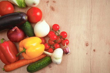 Composition with assorted raw organic vegetables wooden table