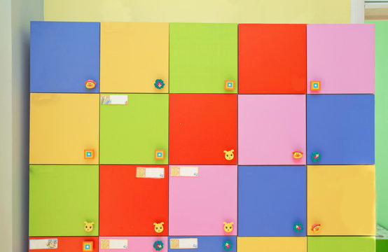 colorful of kid cabinet, wooden furniture for kindergarden or kid's room. changing rooms and lockers of kindergarten . strong rows of color lockers in kindergarden dressing room in pool, children room