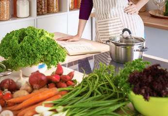 Young Woman Cooking in the kitchen. Healthy Food