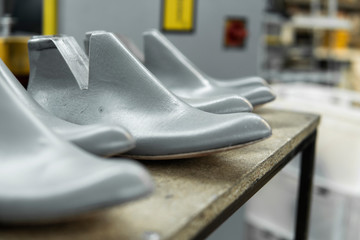 Plastic lasts used in the manufacture of shoes. Row of plastic shoe lasts used to manufacture...