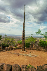 An elevated pole made with several tall trunks, joined and tied with pita ropes in the middle of a square to perform a ceremony in a village in Ethiopia. Travel adventure concep