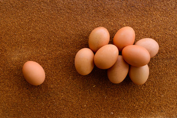 Eggs on brown wood.