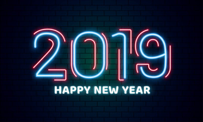 Neon text 2019 Happy New Year on brick wall background can be used as poster or banner design.
