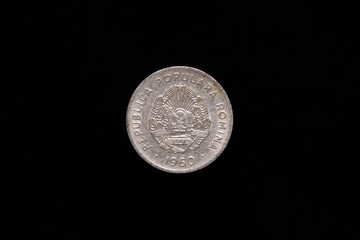 Romanian People's Republic old 15 Bani coin from 1960, obverse showing the coat of arms of Romanian People's Republic. Isolated on black background