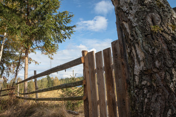 Wooden fence in countryside with beautiful blue sky  and nature in the background