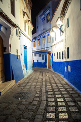The famous blue city of Chefchaouen at night. Details of traditional Moroccan architecture.