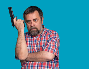 Portrait of a handsome man holding a gun
