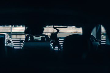 Carjacker stealing a car