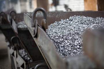 Pieces of ferrotitanium closeup. Ferroalloy used for alloying, deoxidation and degassing of steels and alloys