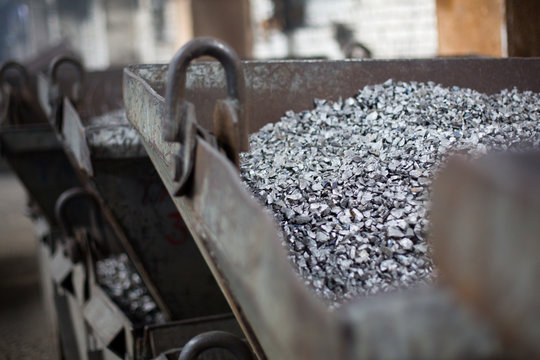 Pieces of ferrotitanium closeup. Ferroalloy used for alloying, deoxidation and degassing of steels and alloys