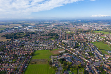 Fototapeta na wymiar Aerial photo of the town of Castleford in the district of Wakefield in the UK, showing roof top view of typical UK rows of houses and streets.