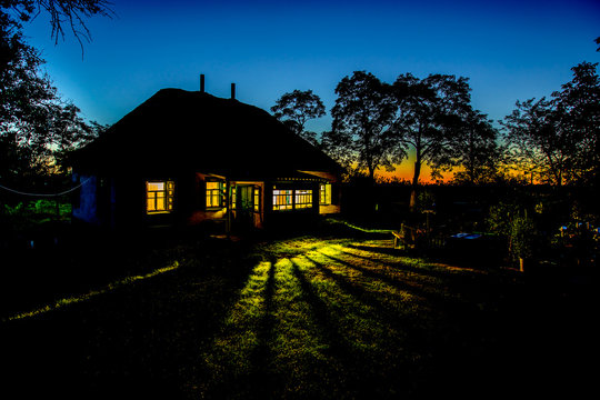 Country House At Night. Window Light In The Dark. Acacia Tree Silhouette. Ukrainian Night.