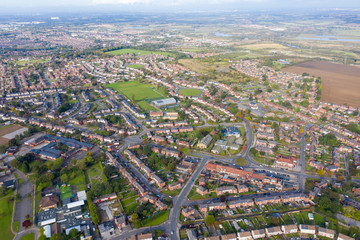 Fototapeta na wymiar Aerial photo of the town of Castleford in the district of Wakefield in the UK, showing roof top view of typical UK rows of houses and streets.