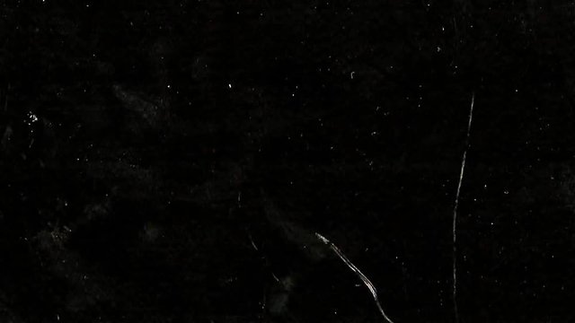 Imitation of an old film overlay for the frame on a black background with fibers and grain HD 1920