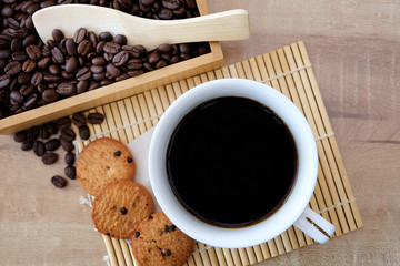 Coffee in a cup and cookies with served
