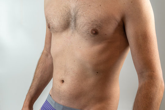 body of middle aged man in blue underpants profile post