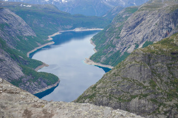 Naklejka na ściany i meble Scenic beautiful Nature - the view from the cliff Trollunga in the Norwegian mountains.