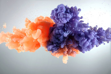 Orange and purple paint splash isolated on white background