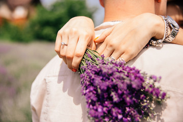 Fototapeta premium a bouquet of lavender in the hands of a girl