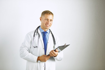 Young confident doctor in a white coat with a stethoscope