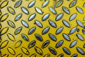 Close up Old Yellow Diamond Metal Plate.