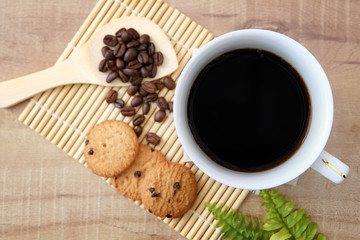 Coffee in a cup and cookies with served