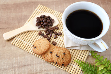 Coffee in a cup and cookies with served