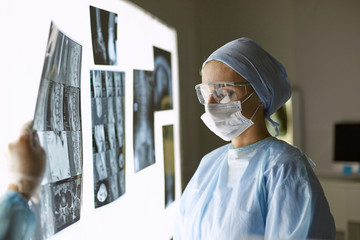 Fototapeta na wymiar Two female women medical doctors looking at x-rays in a hospita