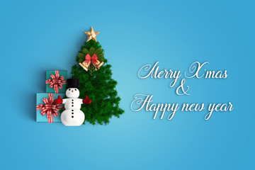 merry christmas and chirstmas tree on color background