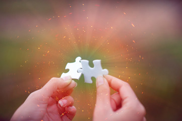 Hands and puzzles, important pieces of teamwork Teamwork concept