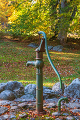 Old water pump in a garden