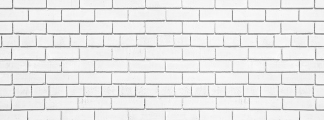 White brick long texture. Lime washed brickwork wide background. Light painted block wall abstract backdrop